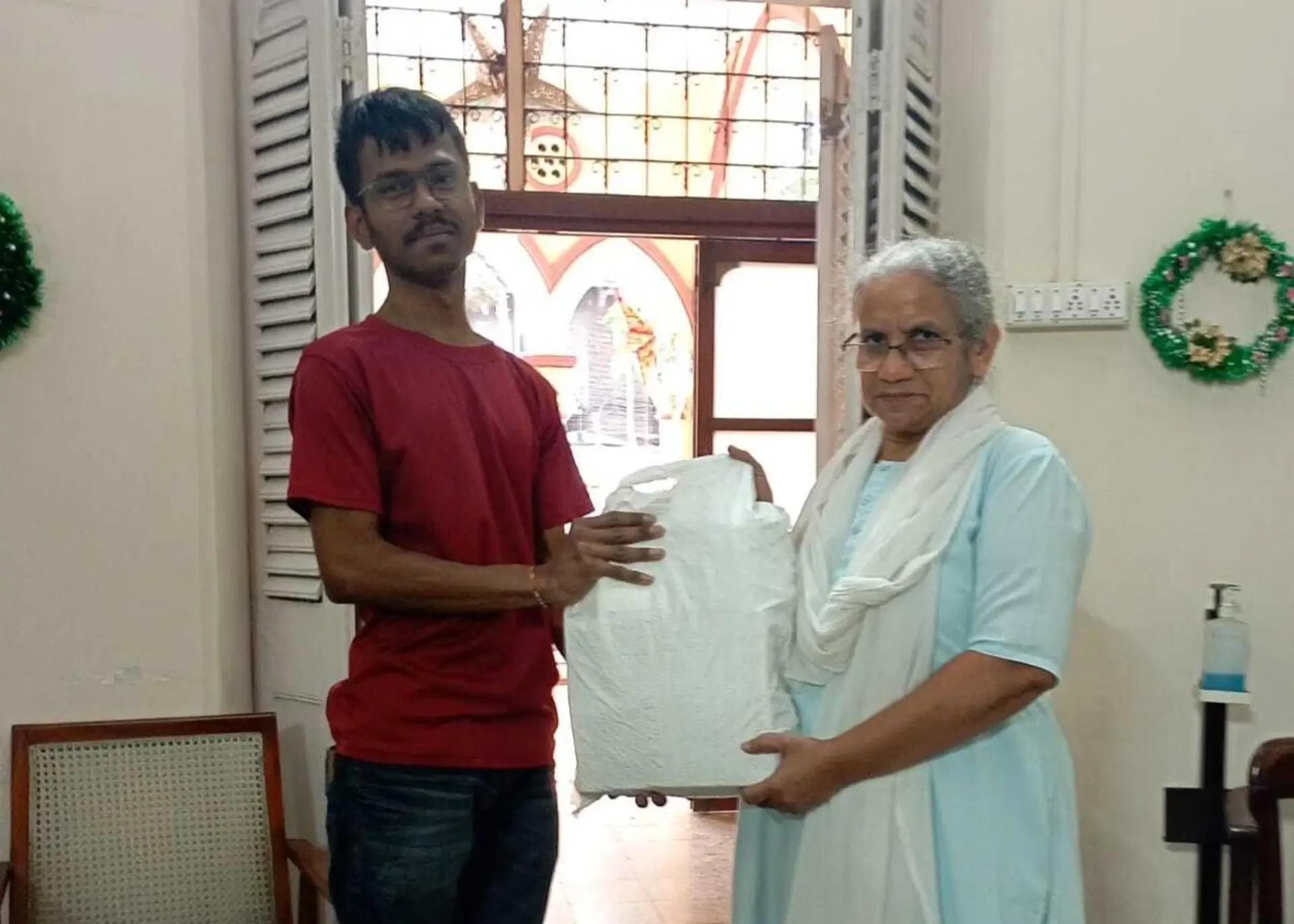 Distributing hampers to the poor